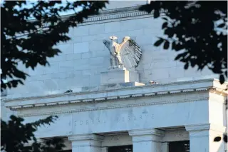  ?? AFP FILE PHOTO ?? Part of the exterior of the Federal Reserve building is seen beyond tree branches in Washington, D.C. on Aug. 18, 2022.