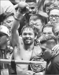  ?? XINHUA ?? Manny Pacquiao celebrates Sunday’s TKO victory over Lucas Matthysse for the WBA welterweig­ht title in Kuala Lumpur.