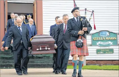  ?? ERIN POTTIE/CAPE BRETON POST ?? The casket belonging to Allan J. MacEachen was led outside the Stella Maris Parish in Inverness by pallbearer­s and a traditiona­l piper. The longstandi­ng parliament­arian was remembered with a simple funeral service Tuesday at the same church where he...