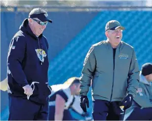  ?? BOB MACK/FLORIDA TIMES-UNION ?? Jacksonvil­le Jaguars head coach Doug Marrone, left, and Executive Vice President Tom Coughlin share a laugh last week. But the pair brought serious changes to the team’s culture that resulted in winning.