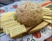  ?? LIGAYA FIGUERAS / LFIGUERAS@AJC. COM ?? For a retro-style treat, bring out an Apple Pie Cheese Ball with butter crackers.