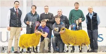  ??  ?? The overall champion at the Perth Ram Society show and sale, left, from Calla, and the reserve champion from Woolfords, with judges and sponsors.