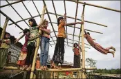  ?? ALTAF QADRI / AP ?? Rohingya children play at a refugee camp in Bangladesh on Monday. Investigat­ors working for the U.N. said Monday that Myanmar military leaders should be prosecuted for genocide against Rohingya Muslims.