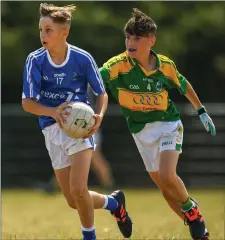  ?? Photo by Harry Murphy / Sportsfile ?? Joseph Cronin Langham of Laune Rangers, Co. Kerry, in action against Luc O’Conor of Claregalwa­y during the John West Féile Peil na nÓg in Meath