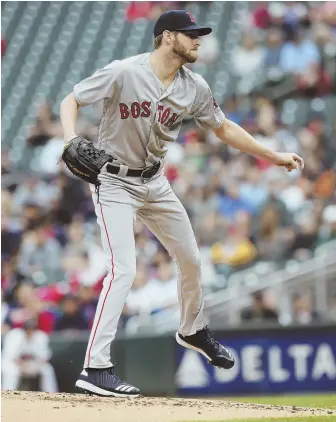  ?? AP PHOTO ?? STARTING IN A NEW CITY: Chris Sale follows through on a pitch as the Red Sox opened a three-game series against the Twins last night in Minneapoli­s.