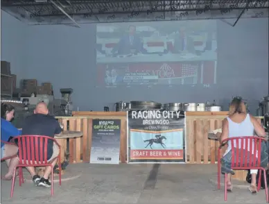  ?? LAUREN HALLIGAN - MEDIANEWS GROUP ?? Guests attend a watch party at Racing City Brewing Company on Opening Day of the 2020 Saratoga Race Course meet.