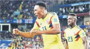  ??  ?? Colombia’s Yerry Mina (left) celebrates scoring their first goal during the World Cup round of 16 against England at Spartak Stadium in Moscow, Russia in this July 3 file photo. — Reuters photo