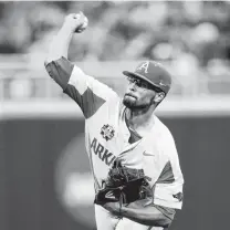  ?? Nati Harnik / Associated Press ?? Arkansas pitcher Isaiah Campbell limited defending champion Florida to two hits over 5 1⁄3 innings in the victory Friday.