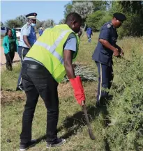  ?? ?? Let’s work… Kavango West police chief Josephat Abel clears a piece of land.
