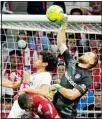  ?? ?? Atletico Madrid’s goalkeeper Jan Oblak punches the ball away during a Spanish La Liga soccer match between Atletico Madrid and Real Madrid at the Wanda Metropolit­ano stadium in Madrid, Spain. (AP)