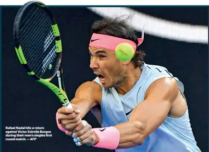  ?? AFP ?? Rafael Nadal hits a return against Victor Estrella Burgos during their men’s singles first round match. —