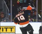  ?? NEWS PHOTO RYAN MCCRACKEN ?? Medicine Hat Tigers defenceman David Quennevill­e celebrates after scoring a goal in a Western Hockey League game against the Kootenay Ice on Oct. 20 at the Canalta Centre.