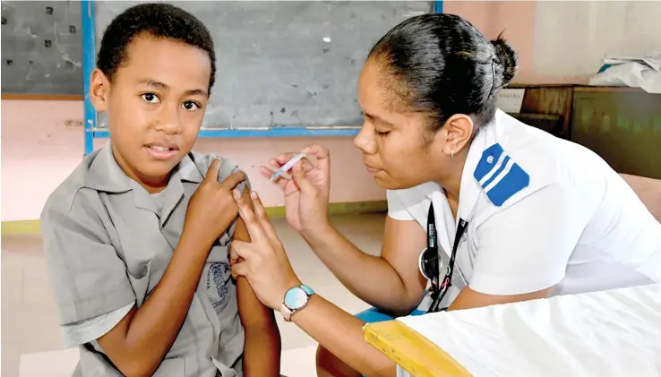  ?? Photo: Ministry of Health and Medical Services. ?? Health worker during the iimmunisat­ion rollout campaign at the Veiuto Primary School, Suva in May.