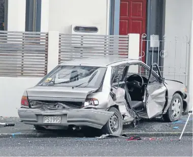  ??  ?? Wreckage at the scene of a fatal crash at the intersecti­on of Hope and Stafford streets in Dunedin in the early hours of yesterday.