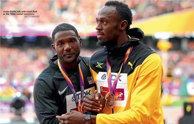  ??  ?? Justin Gatlin, left, with Usain Bolt at the 100m medal ceremony.
