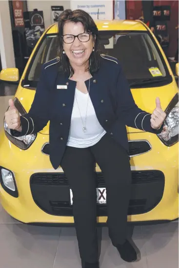  ?? Picture: ANNA ROGERS ?? GOOD CALL: LJ Hooker Yorkeys Knob agent Susan Cooper with the Kia Picanto won by Helen and John Byrnes in a competitio­n.