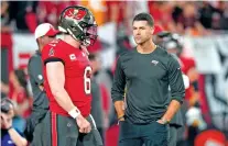  ?? CHRIS O’MEARA/ASSOCIATED PRESS FILE PHOTO ?? Tampa Bay Buccaneers quarterbac­k Baker Mayfield, left, talks to offensive coordinato­r Dave Canales during a Jan. 15 wild-card game against the Philadelph­ia Eagles in Tampa, Fla. The Carolina Panthers have agreed to hire Canales as their new head coach.