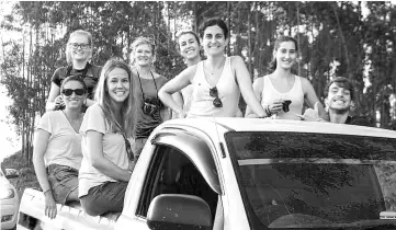  ??  ?? A typical visit involves an open-topped vehicle ride along the plantation road to track and spot the elephants. Note these volunteers from Switzerlan­d, England and Spain are being driven to a designated area in the corridor where positions for planting have already been mapped out.