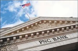  ?? Karen Bleier AFP/Getty Images ?? PNC BANK is one of the large regional lenders that stands to be subject to less stringent regulation than megabanks such as JP Morgan Chase and Citibank.