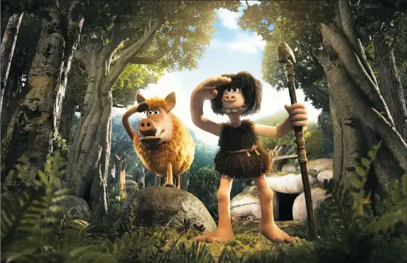  ?? Aardman ?? Hognob (voice of Nick Park) and Dug (voice of Eddie Redmayne) find themselves in the middle of a David-vs.-Goliath-type battle in “Early Man.”