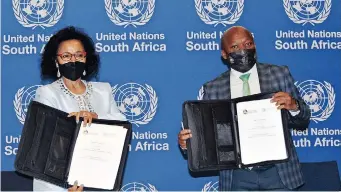  ?? ?? RESIDENT Co-ordinator of the United Nations in South Africa Nardos Bekelethom­as and Premier Sihle Zikalala are pictured with the signed memorandum of understand­ing between the UN and KZN government at the Durban ICC. | TUMI PAKKIES/AFRICAN News Agency(ana)
