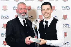  ??  ?? Proud Former Manchester United star Brian McClair presents St Mirren’s Lewis Morgan with the PFA Scotland Championsh­ip Player of the Year Award