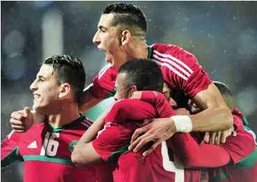  ??  ?? Morocco players celebrate their 4-0 win over Nigeria in the finals of the 2018 CHAN in Casablanca yesterday