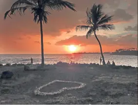  ?? — AP ?? this photo provided by Chris Stewart, the sun sets amidst volcanic smog, in Kailua-Kona, Hawaii. Kilauea volcano on Hawaii’s Big Island has had it all over the past three weeks: molten rock shooting toward the sky, lava oozing from the ground and ash clouds rising miles into the air.