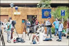  ??  ?? Members of the media are waiting to see South African Olympic sprinter Oscar Pistorius outside a Pretoria Police Station from about 5:00 pm on Feb 25. Pistorius appeared on charges of murdering his model girlfriend Reeva Steenkamp on Feb 14,...