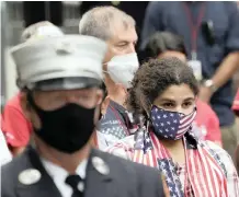  ?? | AP ?? PEOPLE joined in prayer at the Tunnel to Towers remembranc­e ceremony in New York, US, yesterday for victims of the 2011 terror attacks.