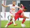  ?? ?? Leipzig’s Konrad Laimer, (left), and Bayern’s Jamal Musiala, (right), challenge for the ball during the German Supercup 2022 soccer match between German soccer cup winner RB Leipzig and German Bundesliga soccer champion FC Bayern Munich in Leipzig, Germany. (AP)