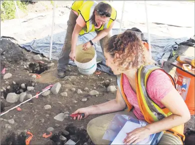  ?? Dave Collins / Associated Press ?? Emma Wink, right, and Stephanie Scialo, part of an archaeolog­ical team, work at the site of a 1600s Native American fort in Norwalk on Tuesday. Archaeolog­ical and Historical Services is removing artifacts from the site for further study.