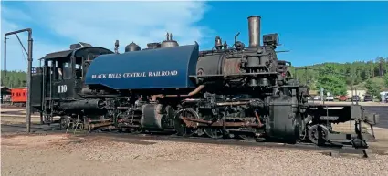  ?? KEVIN HOGGETT ?? Mallet 2-6-6-2ST No. 110 being prepared for the day’s work at Hill City, South Dakota loco depot on June 30. This massive loco was built by Baldwin (60561/1928) to work logging trains for the Weyerhaeus­er Timber Company and spent its 40-year working life in Washington State. It has been in use at the Black Hills Central since 2001.