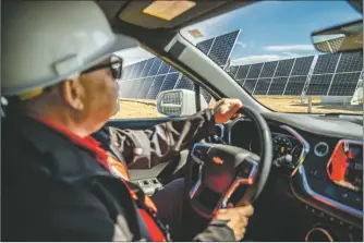  ?? NATHAN BURTON/Taos News ?? Luis Reyes, chief executive officer and general manager at Kit Carson Electric Cooperativ­e, drives through the solar array project on Monday (April 4) on Taos Mesa.