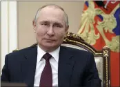  ?? SPUTNIK, KREMLIN POOL PHOTO ?? Russian President Vladimir Putin attends a meeting on social and economic developmen­t of Crimea and Sevastopol, via video conference in Moscow on Thursday.