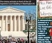  ?? ?? Pro-choice activists in front of the US Supreme Court Building in Washington DC
A demonstrat­or dressed as a character in The Handmaid’s Tale holds a sign in support of abortion rights outside Orlando City Hall, in Florida