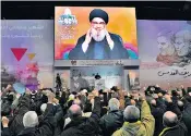  ?? ?? Hezbollah leader Sayyed Hassan Nasrallah greets his supporters; the aftermath of the bombing at the tomb of Qassem Soleimani in Iran