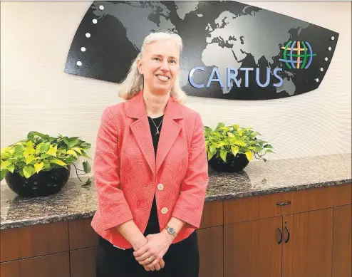  ?? Chris Bosak / Hearst Connecticu­t Media ?? Katrina Helmkamp, CEO of Cartus, at the company’s headquarte­rs in Danbury.