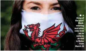  ?? ?? ■ A thing of the past? Maskwearin­g and other rules look set to come to an end in Wales from March 28