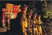  ??  ?? THE CREW includes Gary Mattingly, left, Tim Zanotelli, Brandon Tolp and Devon Elenburg. First responders were stretched thin when the fires began.