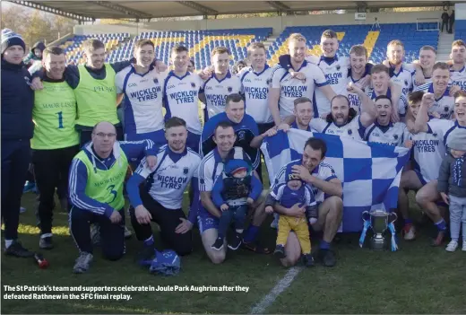  ??  ?? The St Patrick’s team and supporters celebrate in Joule Park Aughrim after they defeated Rathnew in the SFC final replay.