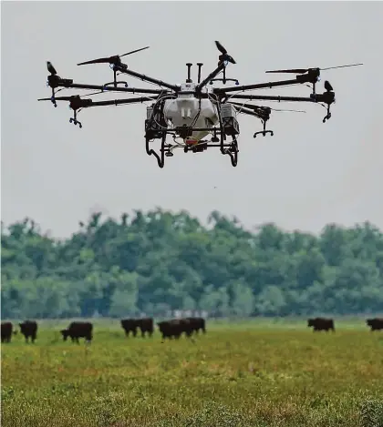  ?? Elizabeth Conley/Staff Photograph­er ?? A drone flies as Hylio employees perform a quality control teston Wednesday in Richmond.