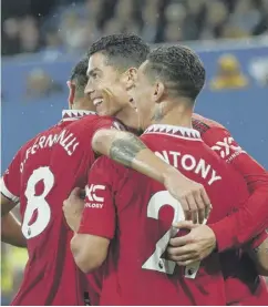  ?? ?? ↑ Cristiano Ronaldo celebrates putting Manchester United 2-1 up