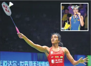  ??  ?? India’s PV Sindhu hits a shot against Carolina Marin of Spain in the women’s singles final; (inset) Marin poses with her gold medal.