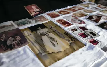  ?? Yi-Chin Lee / Houston Chronicle ?? Jack Gex’s mother’s wedding photograph­s were damaged in her flooded house in Nottingham Forest. Saturday was the first chance for the neighborho­od’s residents to clean their houses since Harvey hit the city.