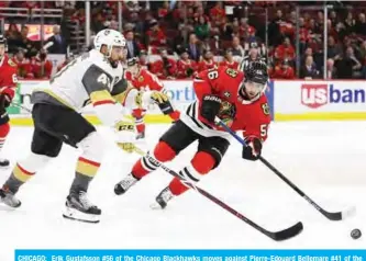  ??  ?? CHICAGO: Erik Gustafsson #56 of the Chicago Blackhawks moves against Pierre-Edouard Bellemare #41 of the Vegas Golden Knights at the United Center on Tuesday in Chicago, Illinois. The Golden Knights defeated the Blackhawks 8-3. — AFP