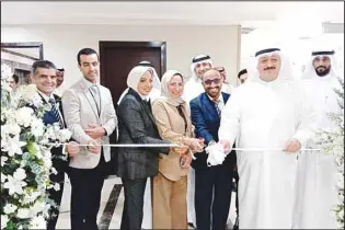  ?? Al-Jarida photo ?? Minister Al-Awadhi and Al-Jumaa during the opening of the new branch in Jahra.