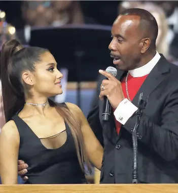  ??  ?? Bishop Charles H. Ellis, III speaks with Ariana Grande after she performed during the funeral for Aretha Franklin at the Greater Grace Temple in Detroit last Friday.