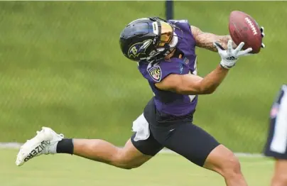  ?? KIM HAIRSTON/BALTIMORE SUN PHOTOS ?? Ravens wide receiver Tylan Wallace makes a catch during minicamp practice June 16. Whether Wallace can become more than a special teams contributo­r and give quarterbac­k Lamar Jackson a reliable target is one of the major questions of the offseason.