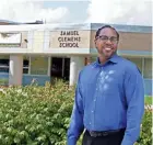  ?? RICK WOOD / MILWAUKEE JOURNAL SENTINEL ?? Milwaukee Journal Sentinel columnist James E. Causey stands outside Samuel Clemens Elementary School, where he attended classes from third to sixth grade.